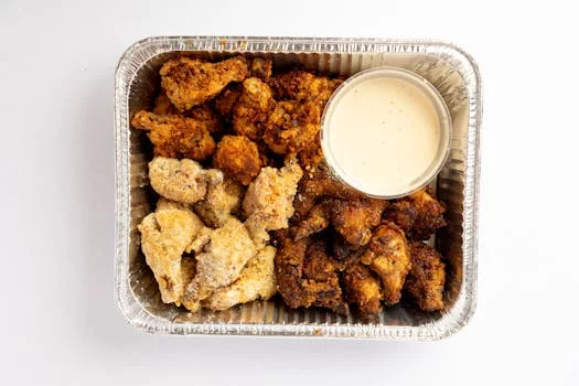 golden chicken wings with dipping sauce